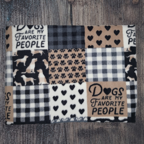 Self-heating pet bed, quilt-like squares with various designs, checkered, hearts, paws and some that say Dogs are my favorite people.